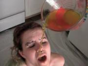Horny lesbian teen taking a bowl of piss in her mouth