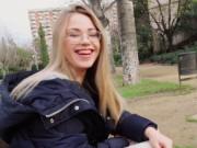 Blonde reading in the public park