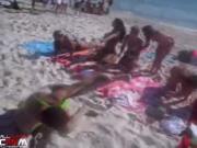 A guy wears mankini on a beach for spring break dare