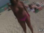 Oily topless bikini teens on beach