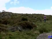 Male models As he climbs to the top of a rocky hill Bra