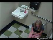 Good looking blonde babe defecating in public toilet 1