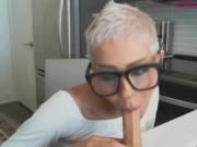 Short haired mature woman fucks her dildo