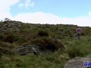 Twink movie of As he climbs to the top of a rocky hill