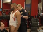Hot police officers apprehend him in a barber's shop