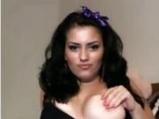 Beautiful brunette licks her boobs