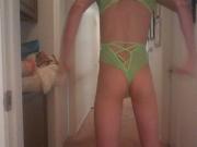 Sissy tries on green lingerie