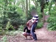 Man stalks a woman in a park