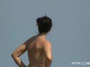 Aluring beach video of nudists enjoying the warm sun