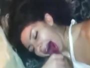 Attractive Brunette sucks a big dick and gets a facial