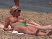 Stunning Milf with big tits on topless beach