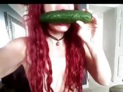 A Kinky Redhead Pleasures Herself With A Cucumber