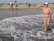 Adult woman shows her charms in the dunes