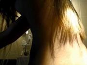 Cute blonde plays in bathroom