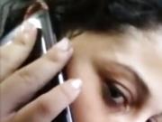 Brazilian woman talks to her boyfriend while sucking another
