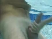 Funny handjob inside swimming pool