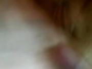 Brunette with glasses puts a dildo depply in her pussy