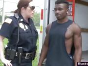 Arrested black stud gets cock pleased by policewomen
