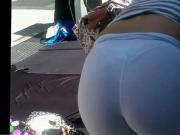 brunette in white pants bend over candid