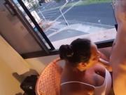 BBW MILF blowing cock in front of a window