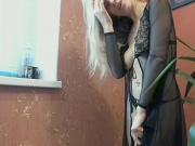 Blonde woman in see through dress teases