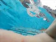 girsl underwater at pool