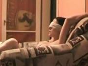 Blindfolded brunette masturbating makes a sextape on the sofa