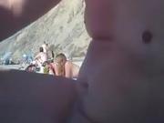 2 girls make fun with a guys microdick on a nudist beach