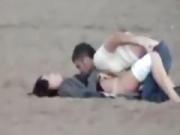 Couple on the beach gets spied on having sex during daytime