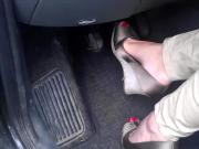 Sexy Woman With Red Toenails In Sandals Plays Around With Her Gas Pedals