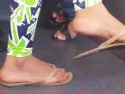 Feet in sandals on bus