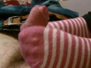 Striped cotton socks make a soft and warm footjob