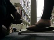 Creep cums on foot under table in library