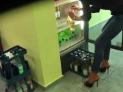 Stiletto clad employee loading fridge