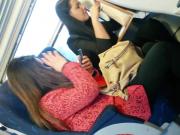 Amateurs in slingbacks pumping feet on train