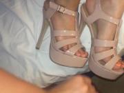 Shoejob between two sexy high heeled strappy sandals