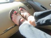 Changing shoes in the car and putting feet on dashboard