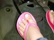 These Cute Feet With Pink Sandals and White Nail Polish Push That Pedal Up and Down Again and Again