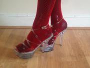 Red fishnets in clear platforms