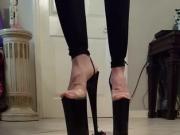Tall heels obliterating a small toy