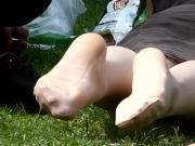 Candid view of soft amateur feet in public park