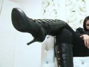 Naughty German mistress in black boots enjoying some feet JOI action