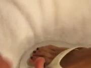 Feet and flip flops bathed in cum