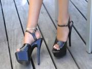 Patent leather open toed ankle straps on deck