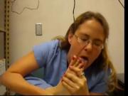 Nurse licks her own feet
