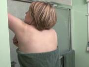 Cute blonde babe masturbates in the shower