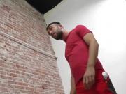 Bearded guy sucking off a black cock at a gloryhole