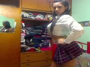 Big tits & ass Latin schoolgirl striptease out of her uniform