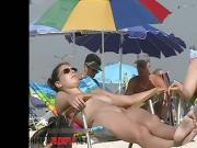 A lovely chick in a nude beach spy cam video